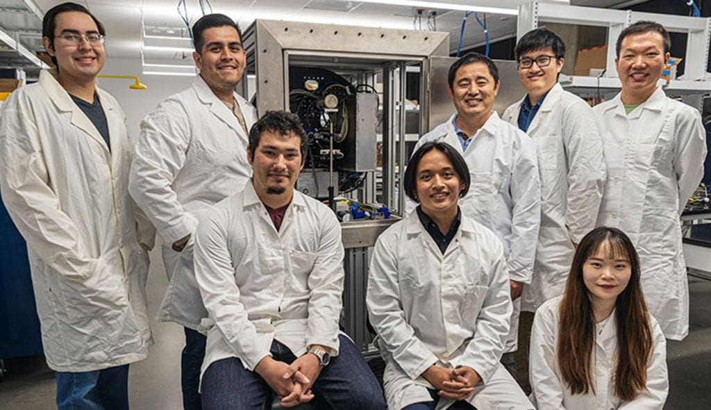 UCM Bioengineering Professor Changqing Li, standing third from right, and his student research team. Photo by Veronica Adrover.