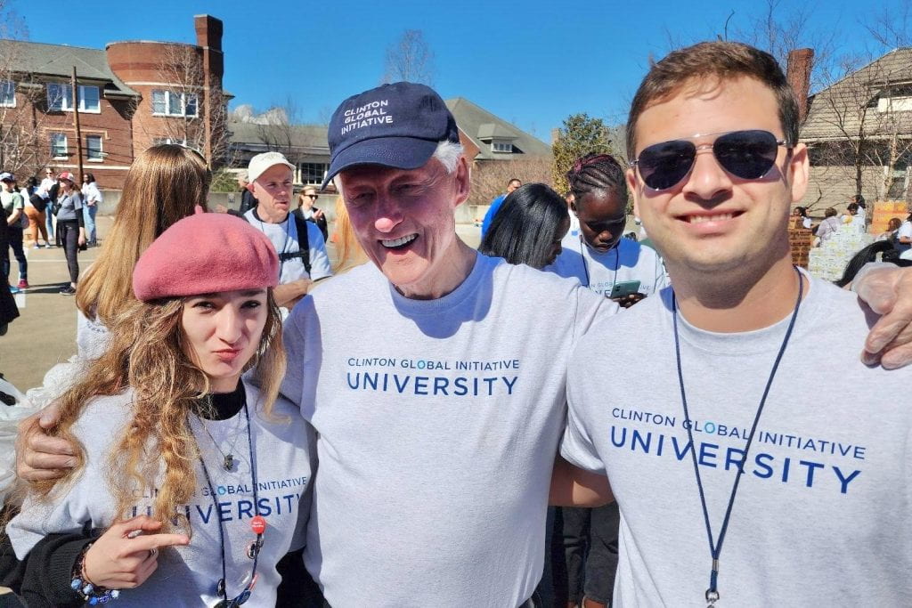 Adriano de Bernardi Schneider (right) with 42nd President of the United States, Bill Clinton and CGIU mentor, Maria-Luiza Popescu (left) during a day of service work in Nashville, Tennessee. Photo courtesy of Adriano de Bernardi Schneider.