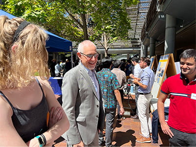 Dean Wolf speaks with students during Partners' Day 2022.