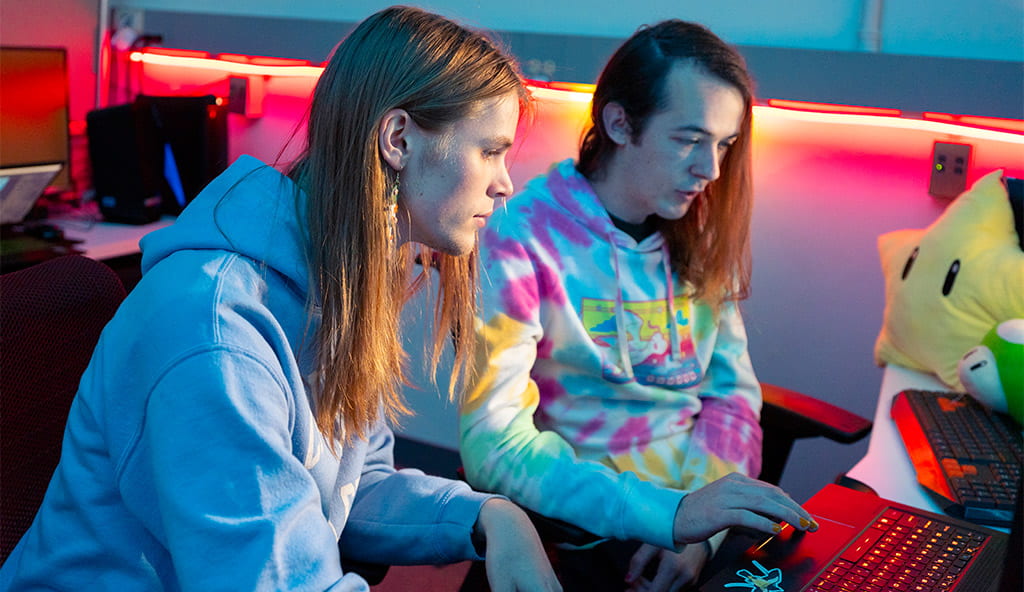 Two computational media students in a game design lab